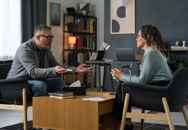 discussing-project-modern-office-setting-two-people-sitting-across-each-other-modern-office-engaging-conversation-330437599 discussing-project-modern-office-setting-two-people-sitting-across-each-other-modern-office-engaging-conversation-330437599